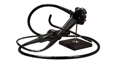 Picture of a black endoscope against a white background.
